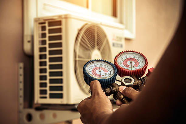 Professional Air Conditioning Service technician working in South Grafton, MA